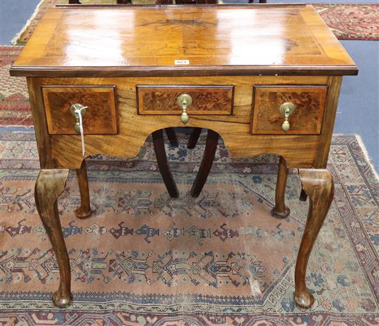 A George I style cross-banded and feather-banded walnut lowboy on cabriole legs H.75.5cm, W.76cm